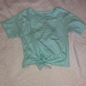 A greenish blue crop top